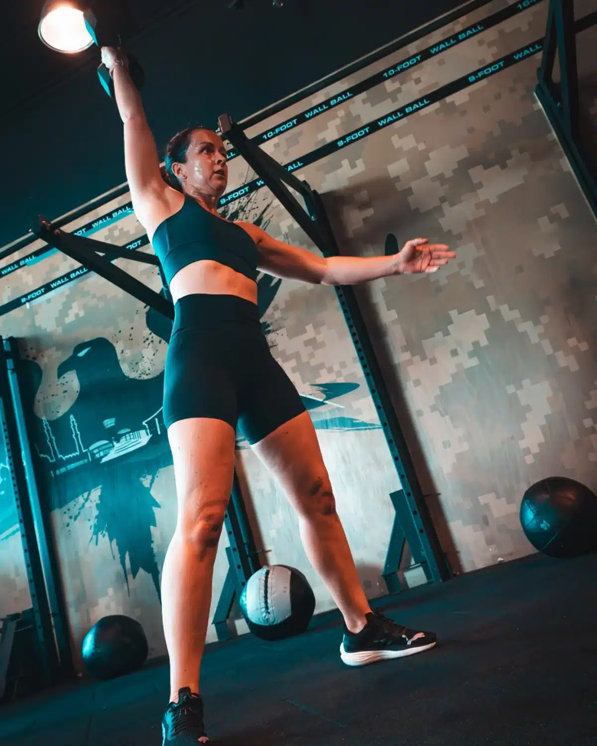 Athlete performing an overhead functional fitness movement
